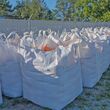 Filled sandbags lined up behind Public Works building.
