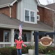 A woman stands outside the Saratoga Inn