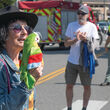 Gerri Roche holding parrot puppet.