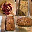 Three loaves of cranberry bread and a spoonful of cranberries.