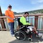 Bob Grace, left, pushes Francis Sylvester in his wheelchair
