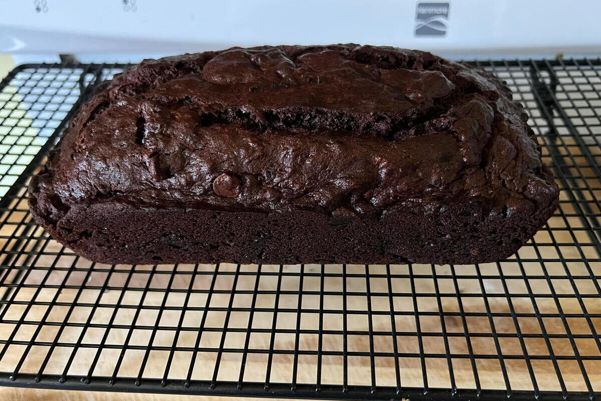 Loaf of chocolate banana bread on cooling rack