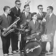 Six musicians from the 1950s gather for a photo