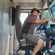 UPS driver Hector Soltero sits behind the wheel of his delivery truck