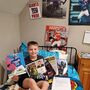 Boy poses with NFL swag