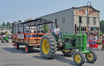Steve Schuh drives his tractor in a parade