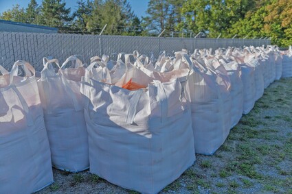 Filled sandbags lined up behind Public Works building.